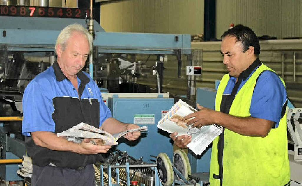 APN Print Perfect Binder operators Roland Mayer and Fred Stowers inspecting the latest stack of magazines. APN Print Perfect Binder operators Roland Mayer and Fred Stowers inspecting the latest stack of magazines.